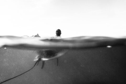 Surfer inside water photographers from bottom in Mexico